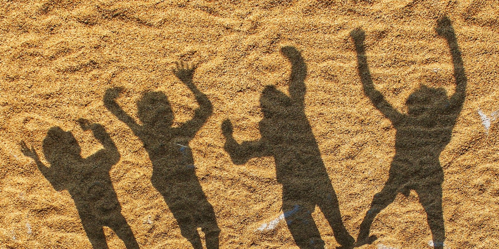 Apple will have to comply with another App Store age verification law, in California | Shadows of children seen on sand