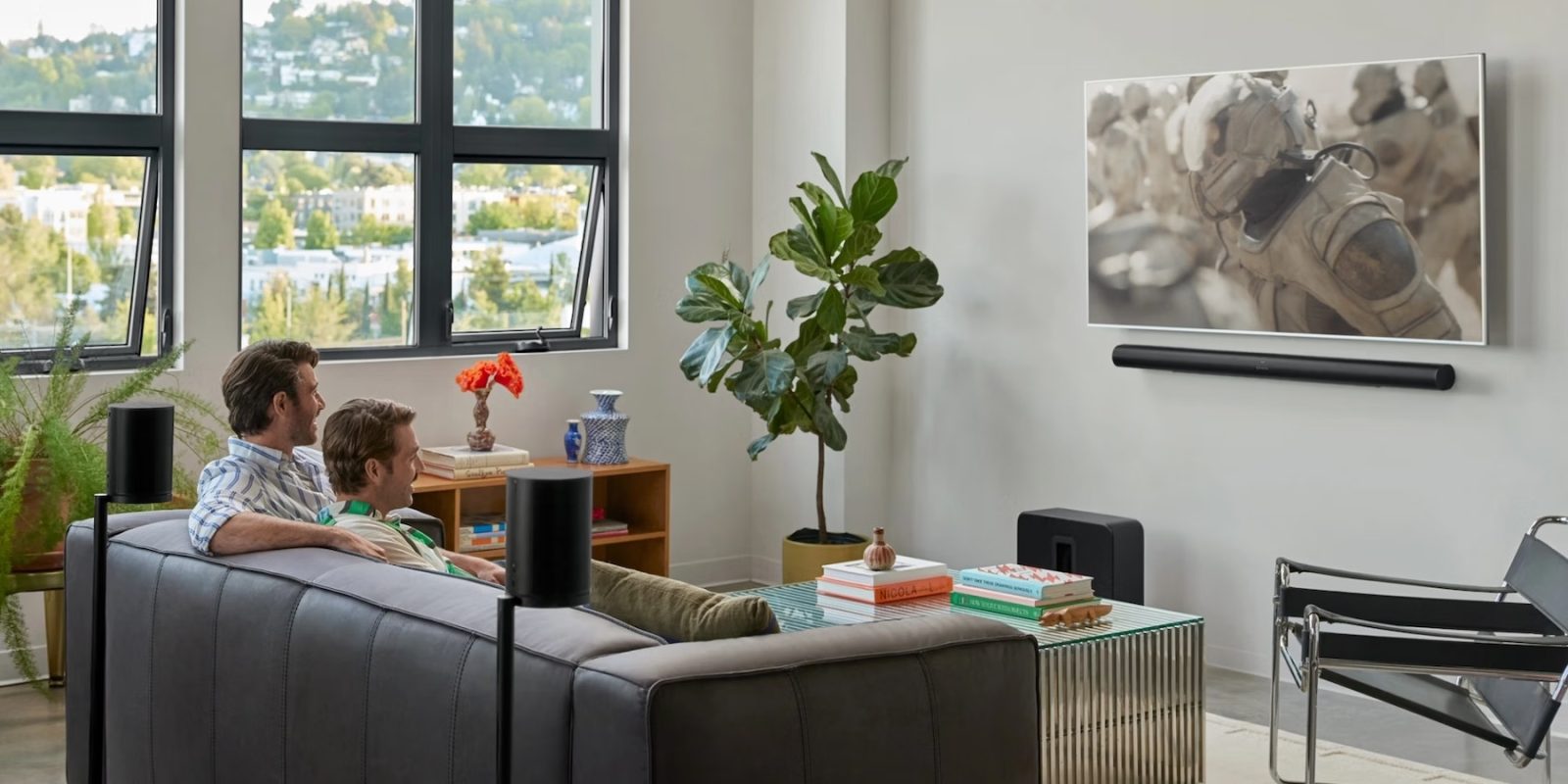 A man sitting on a couch in a living room