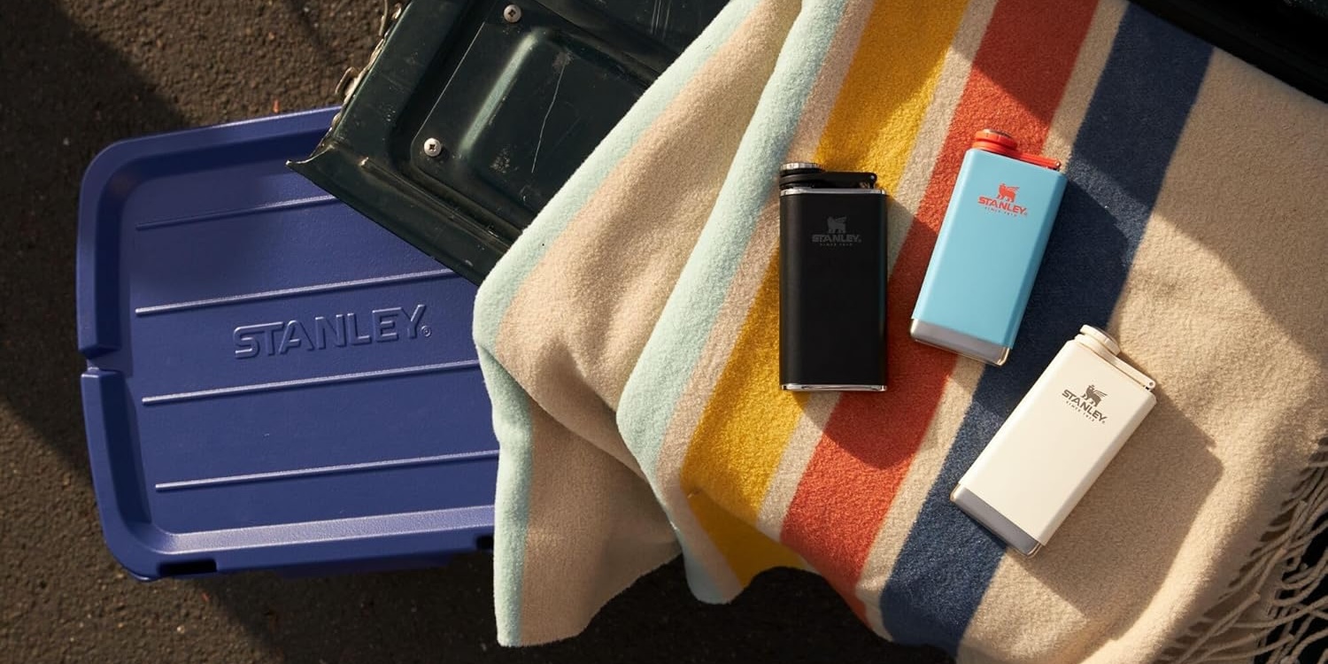 A blanket and lighters on a beach towel