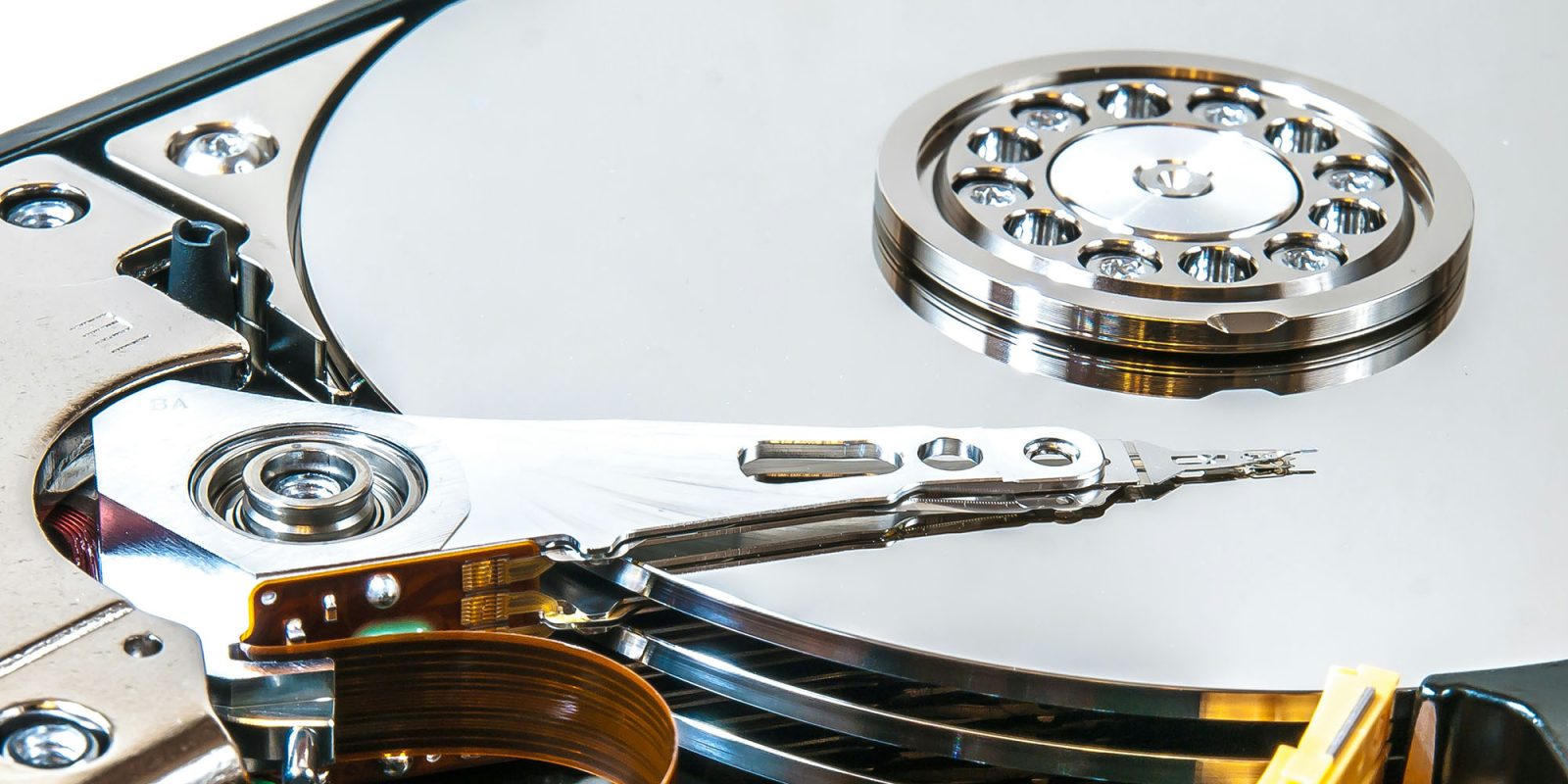 Here's how to backup your Apple devices | A close-up photo of the inside of a hard disk drive