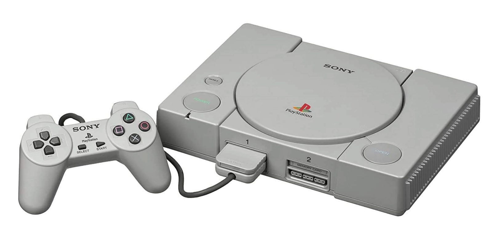 A grey gaming console with a controller