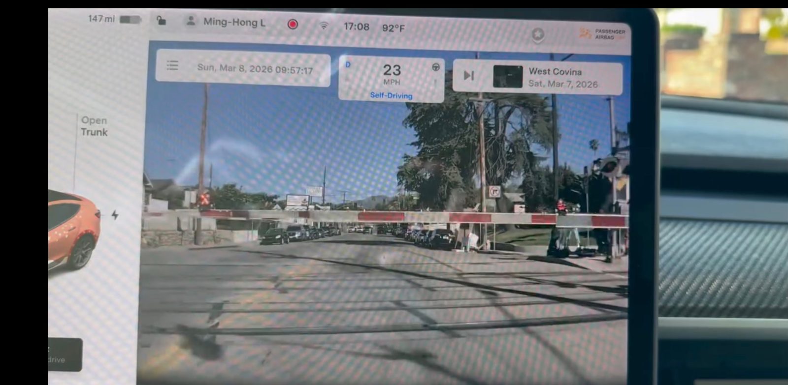 Tesla Full Self-Driving drive through train crossing barrier