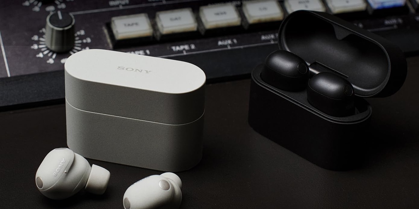 A pair of wireless earbuds and a box on a table