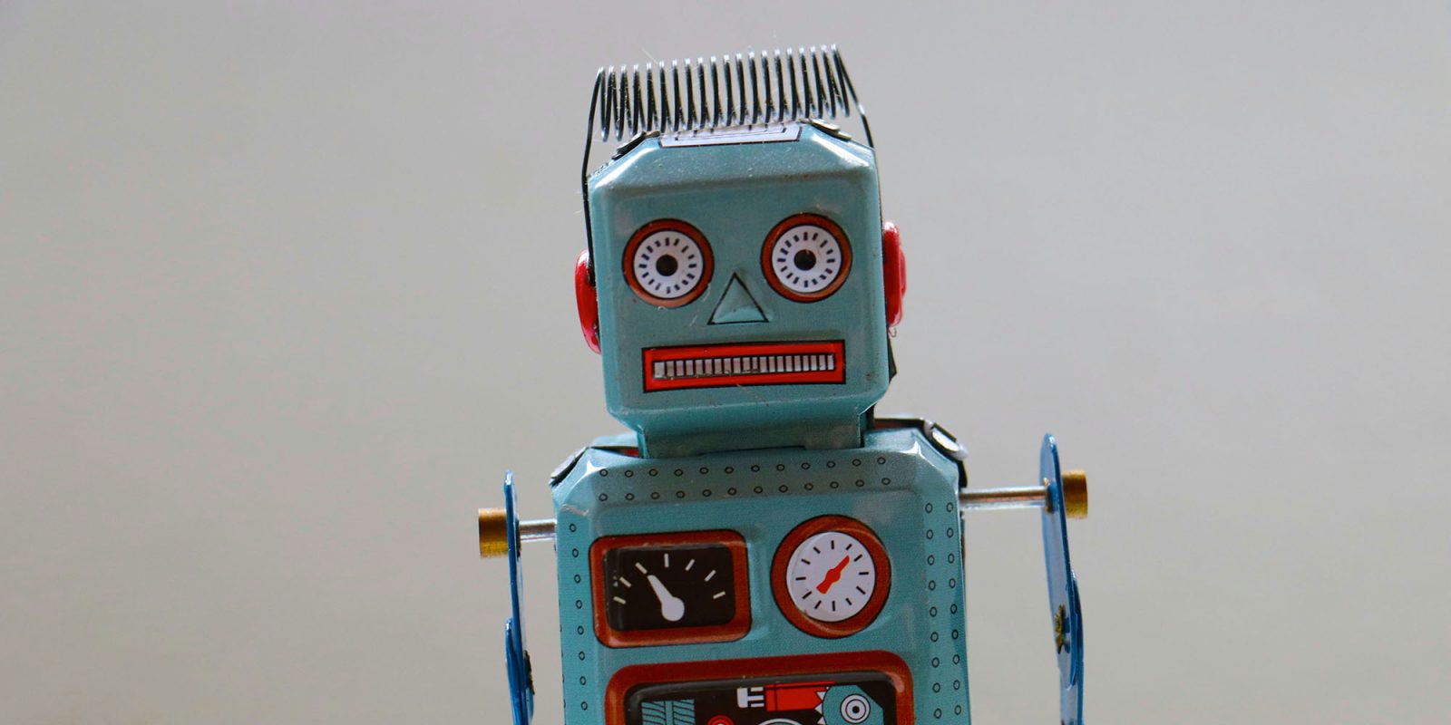 WhatsApp joins the appalling trend for AI-written replies to messages | Crude-looking toy robot shown.