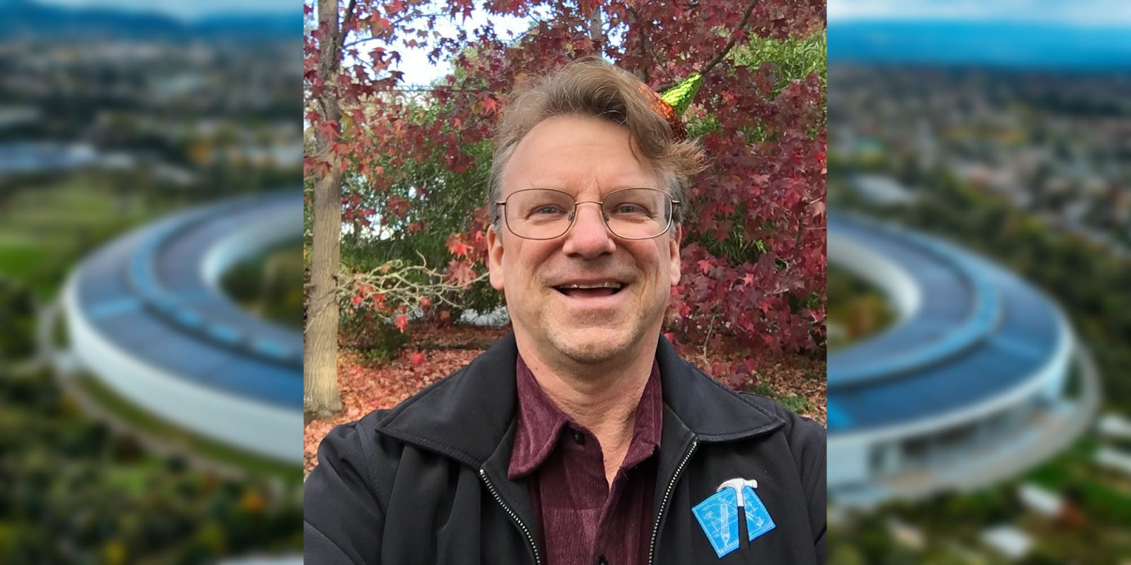 Apple employee #8 Chris Espinosa on his entire working life at one company | Espinosa pictured against blurred background of the Apple Park campus