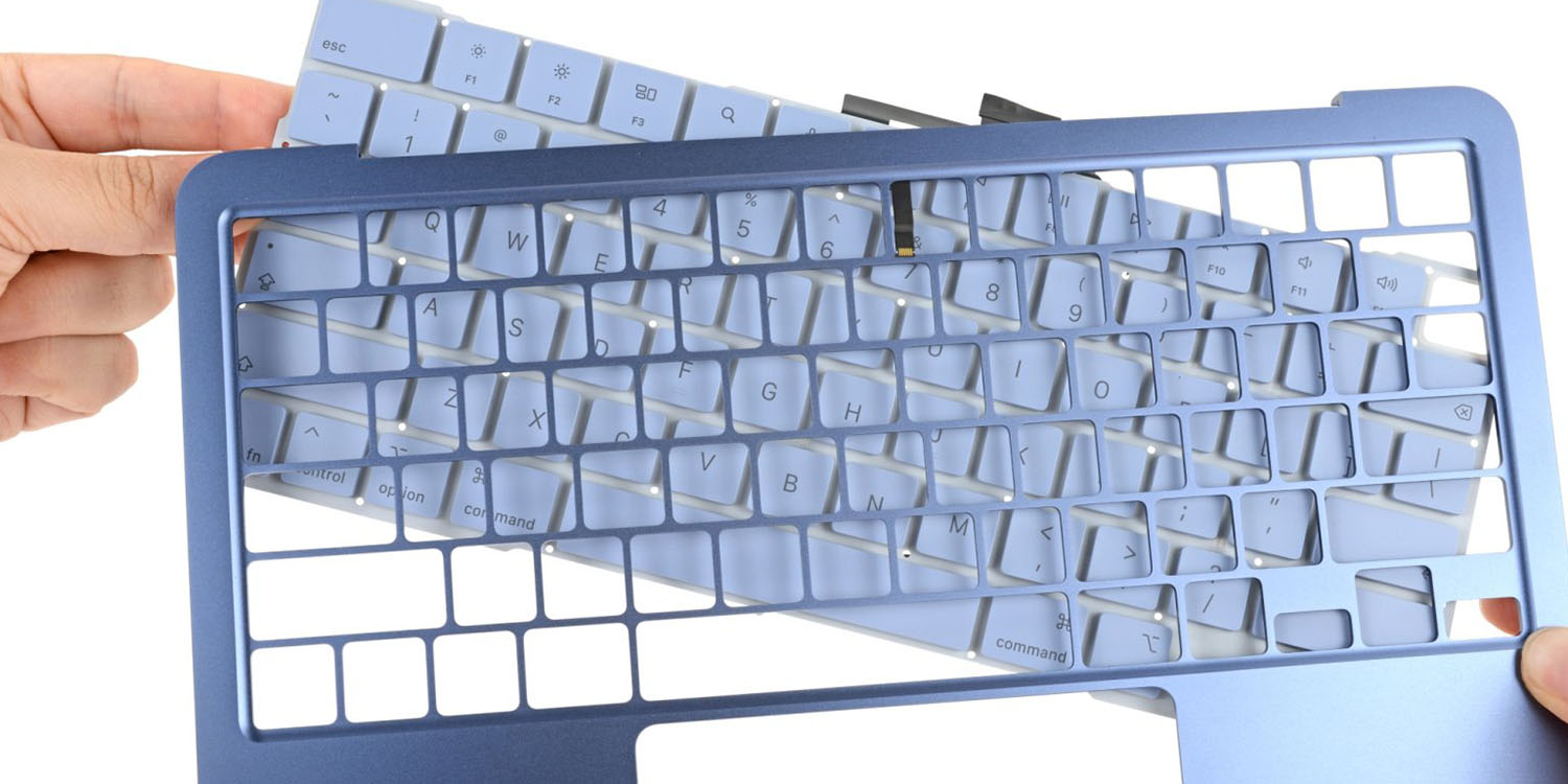 Apple gets bottom ranking for repairability of iPhones and MacBooks | Disassembled MacBok Neo keyboard shown