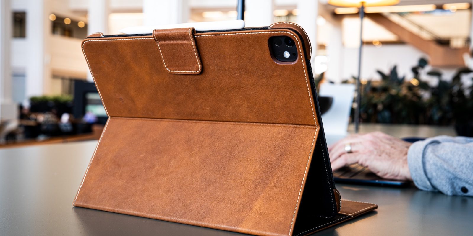 A brown leather case on a table