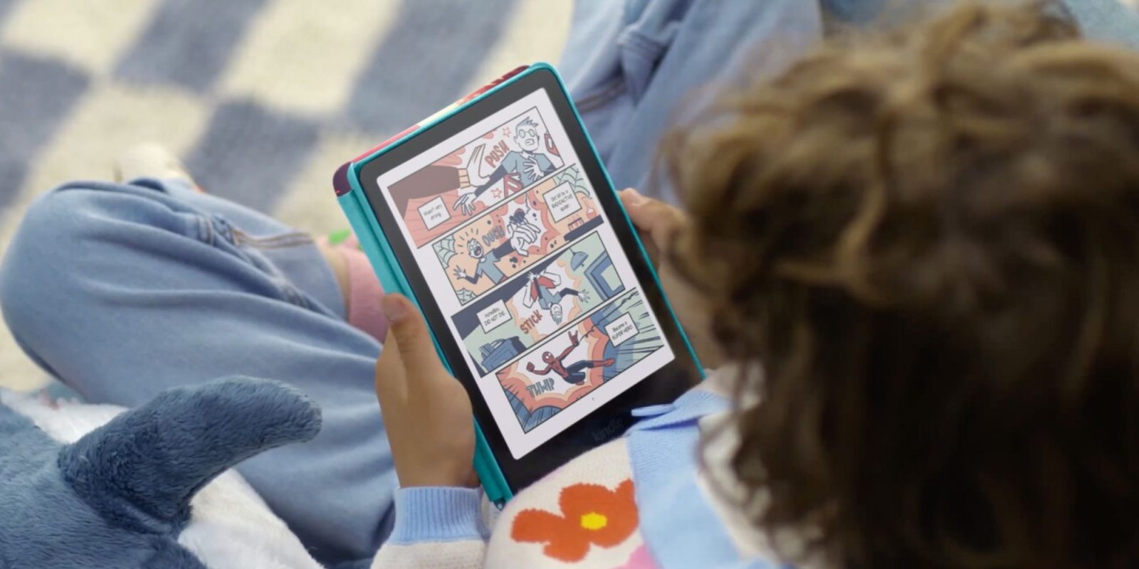 A child holding a tablet