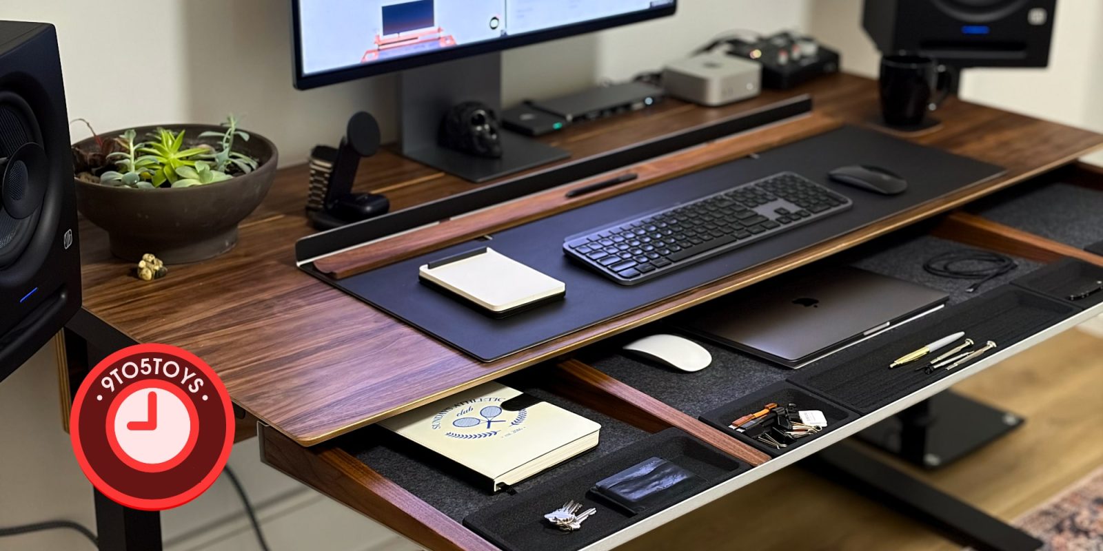 A desk with a computer and a keyboard