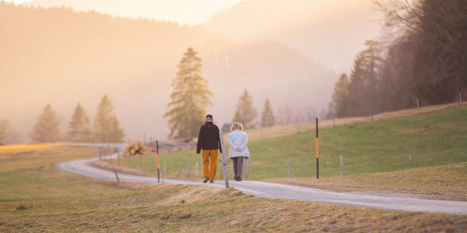Apple outlines 50 ways to make devices easier to use as we age | Photo shows two seniors out for a walk in the countryside