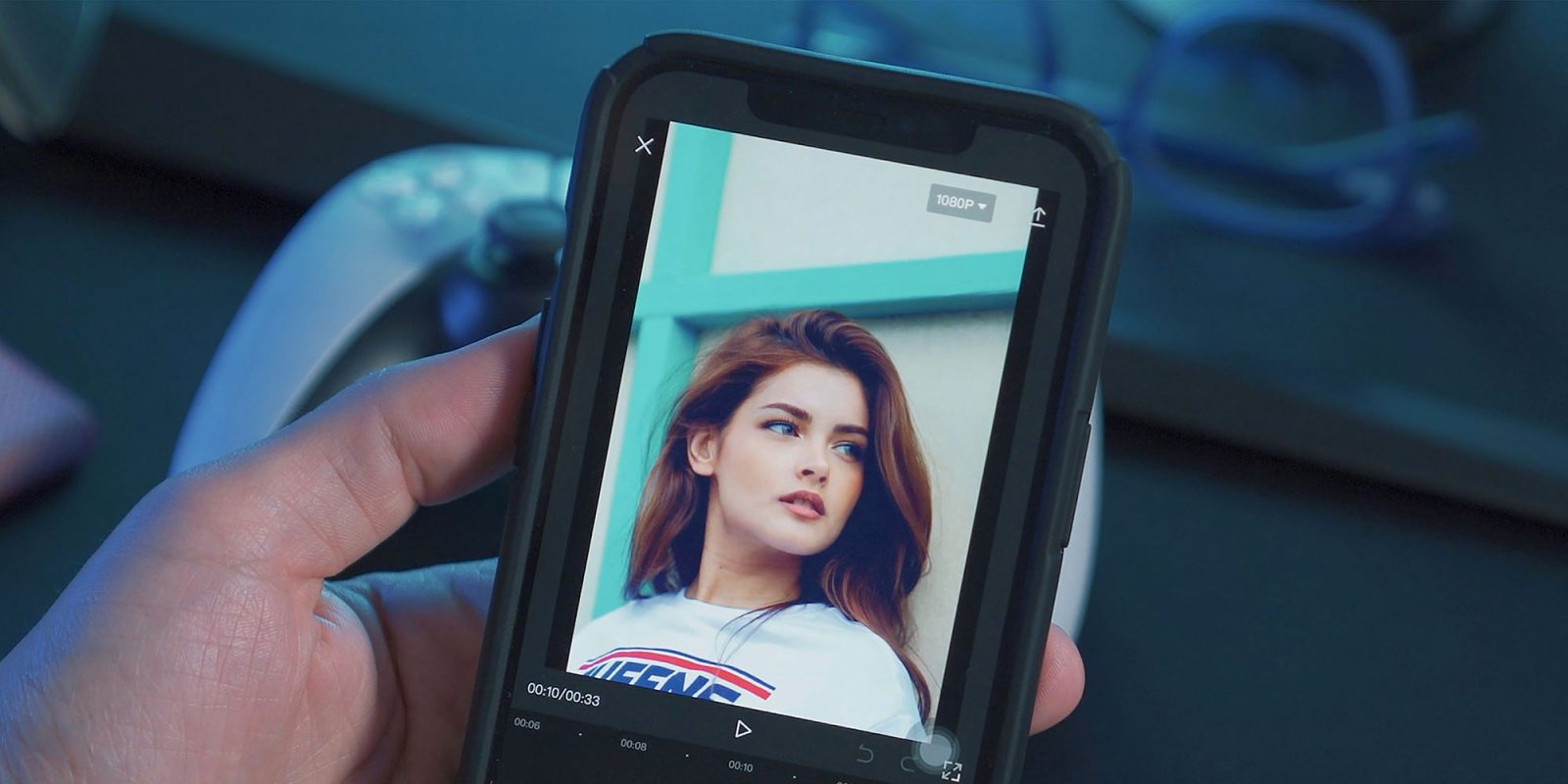 ClarityCheck people-finder left millions of face photos exposed | Image shows a photo of a woman's face on a smartphone against a dark background