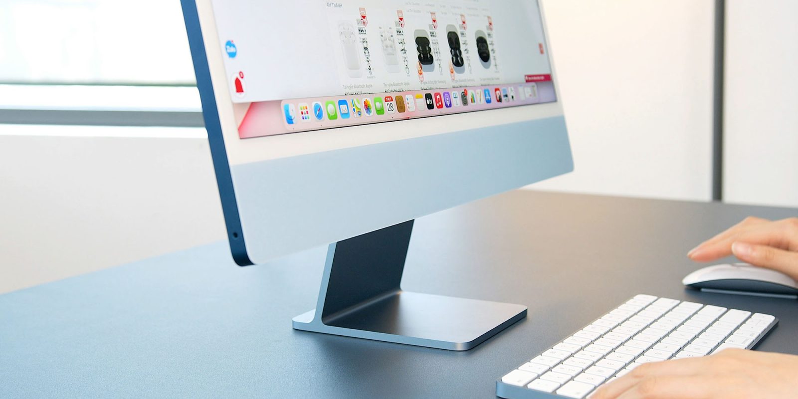 How to set different default languages in different Mac apps | Photo shows a close-up of someone using an iMac