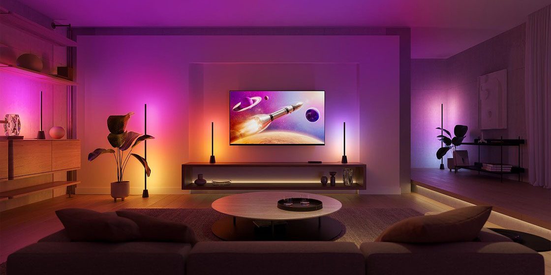 Syncing Hue lights to your TV now starts at $120 | Photo shows living room lighting being synced to a photo displaying a space scene