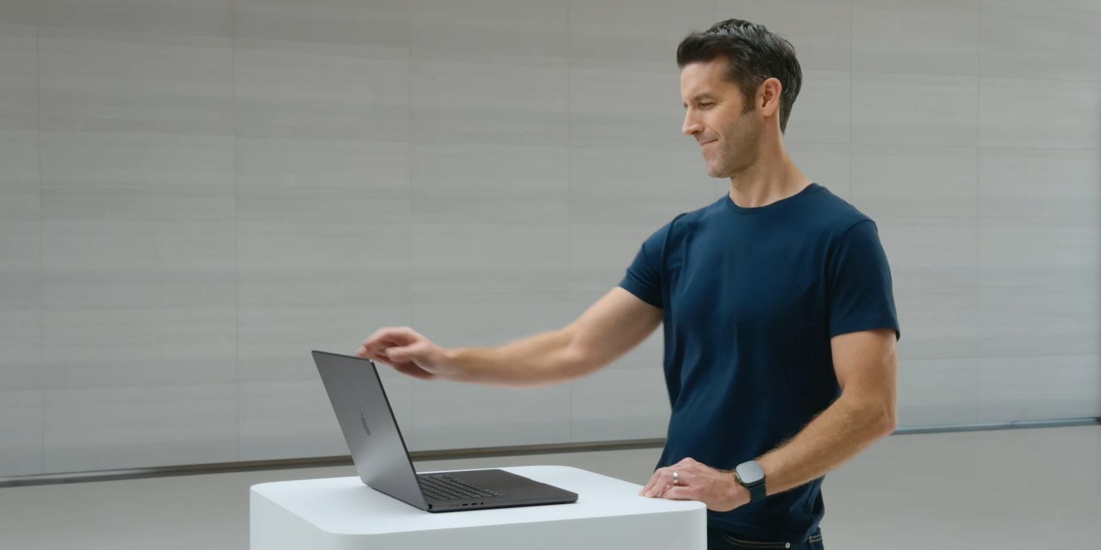 AAPL gained 2,736% under Cook, but Ternus doesn't have to emulate him | Photo shows Ternus opening a MacBook