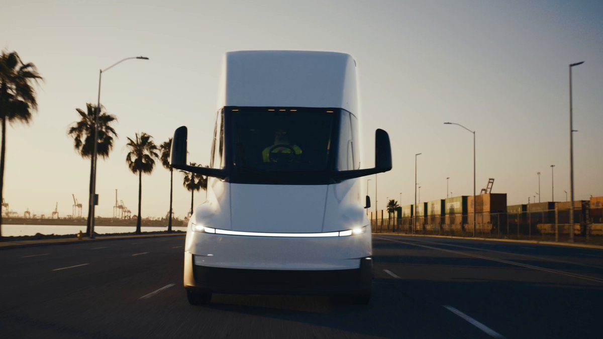 Tesla Semi electric truck driving at dusk