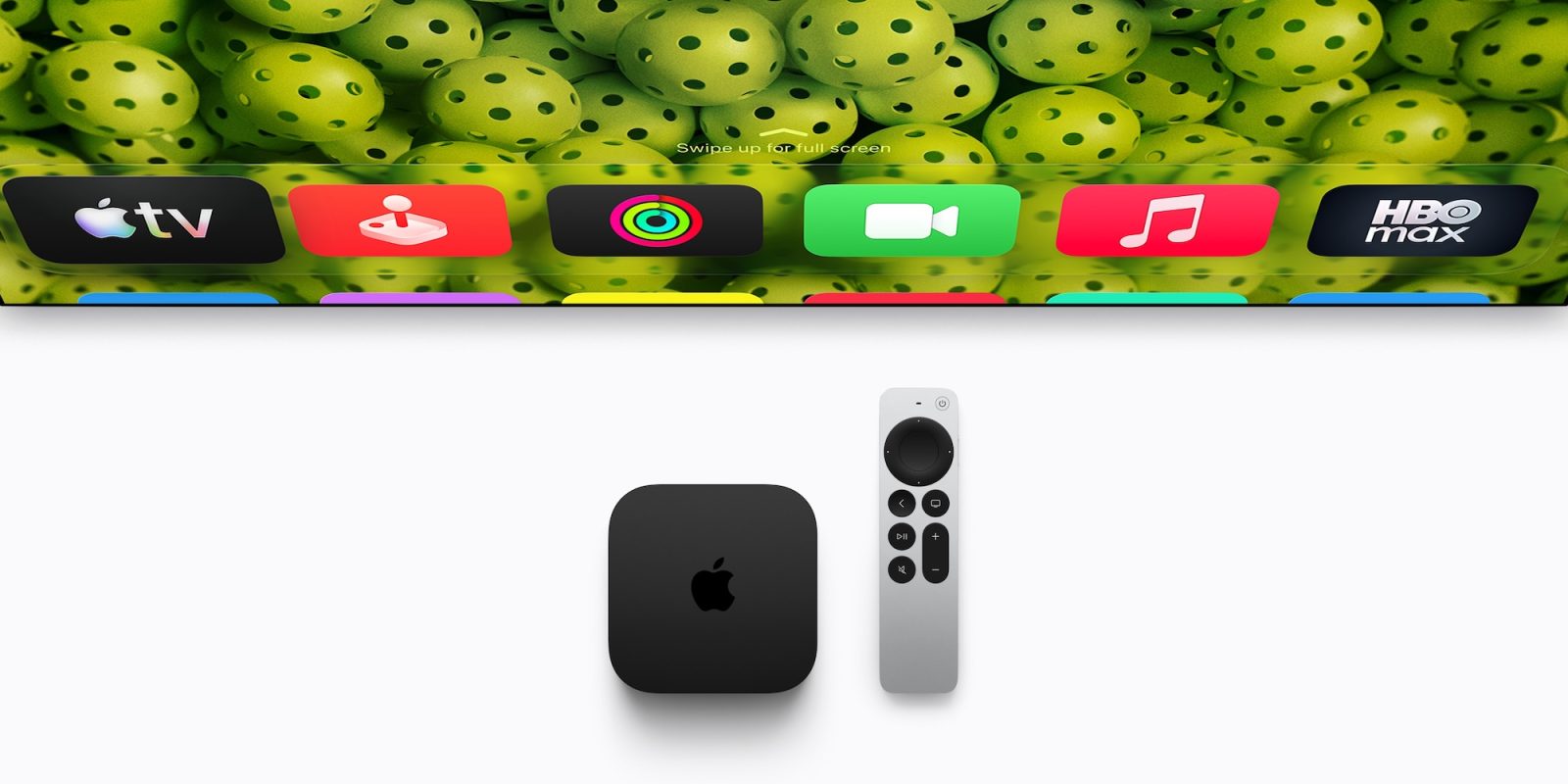 A remote control next to a television
