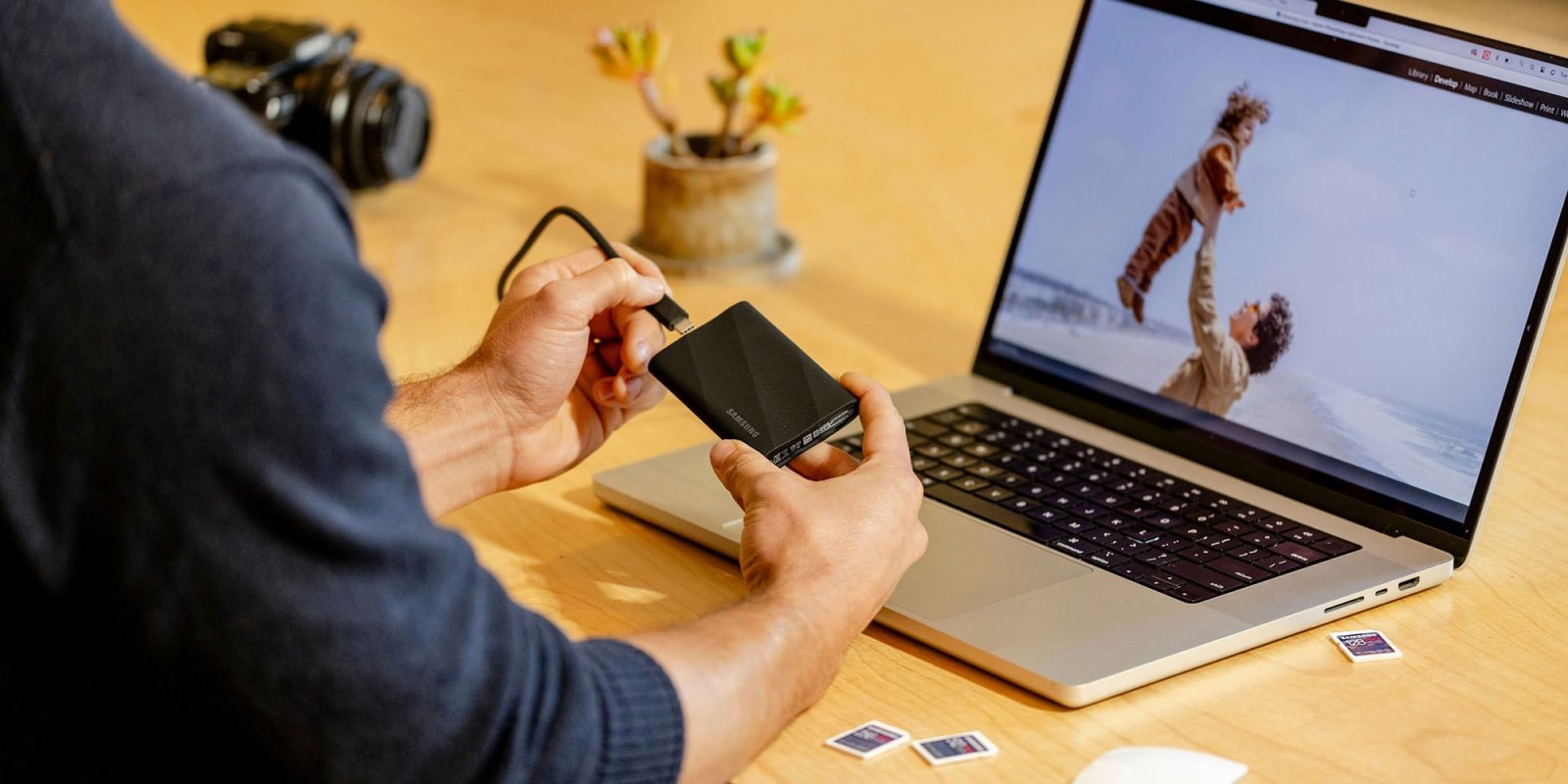 Apple tackling Full Disk Access on Mac is crucial, but it must avoid one mistake | Photo shows an SSD being connected to a MacBook