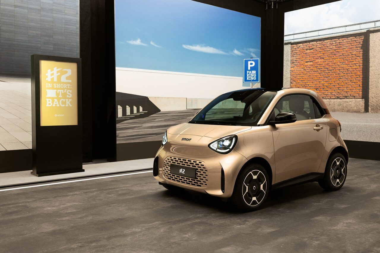 Smart #2 Premium in gold metallic, front three-quarter view