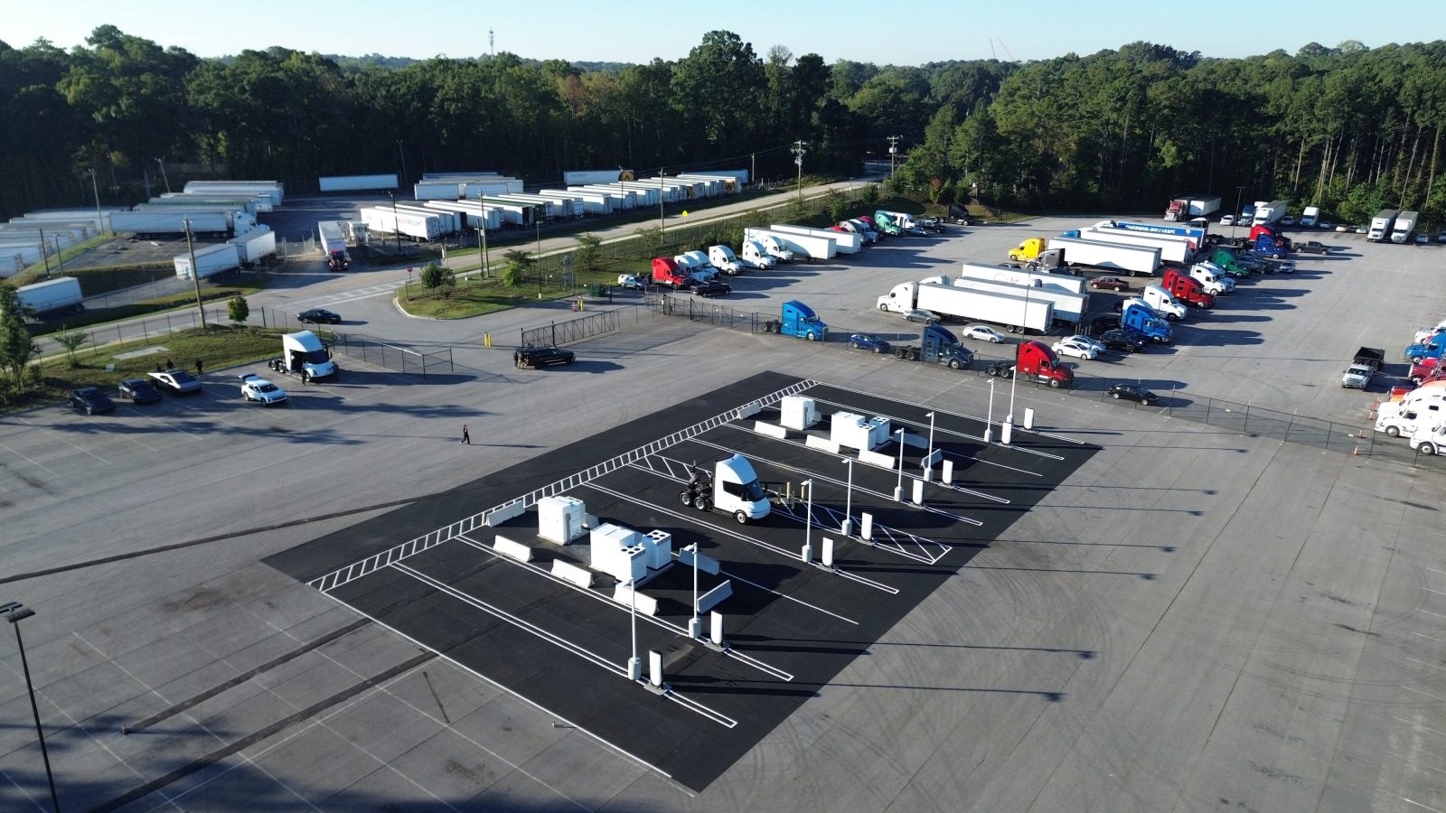 Aerial view of a Tesla Semi Megacharger site in Georgia with a Semi tractor parked at a stall